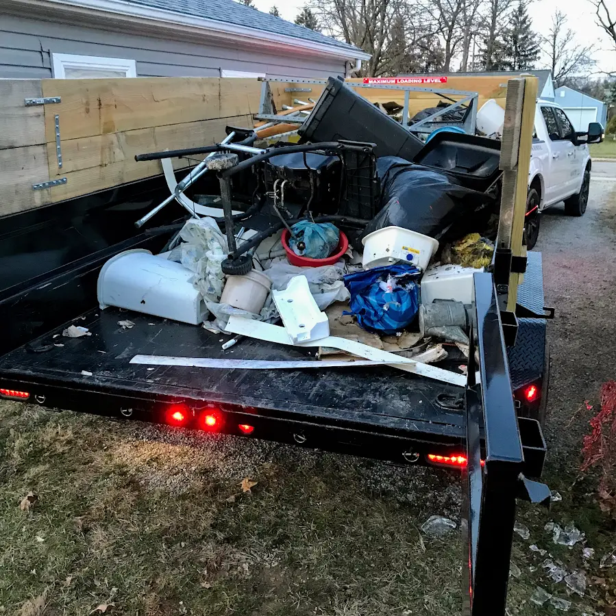 Roll-off dumpster delivered to a residential driveway in Sterling